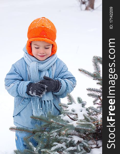 Little boy playing snowballs