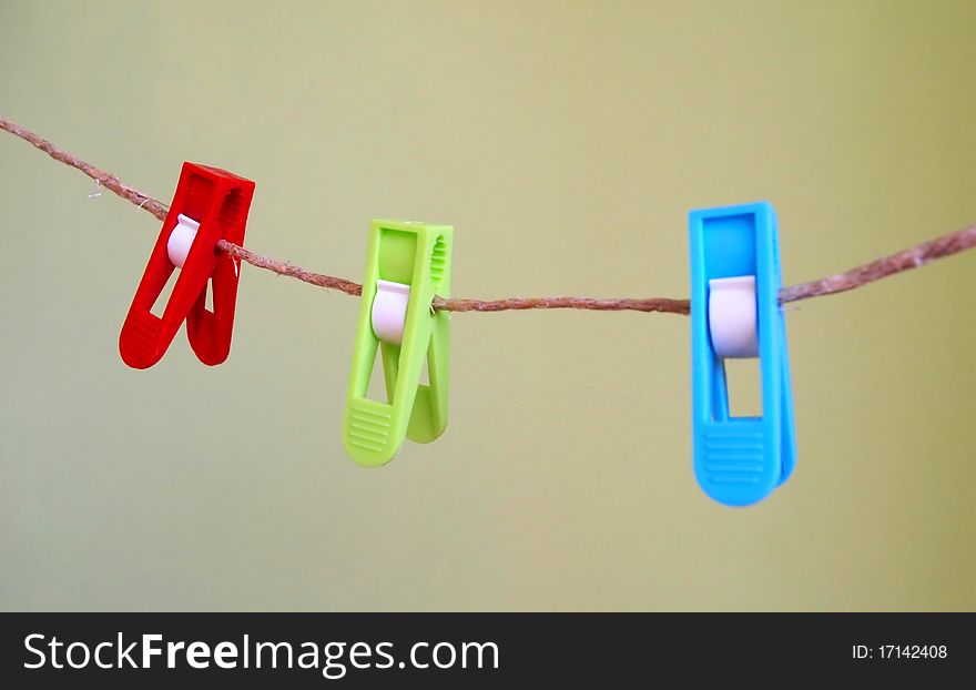 Three clips on a washing-line