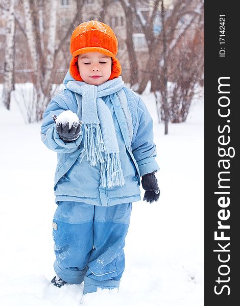 Little Boy Playing Snowballs