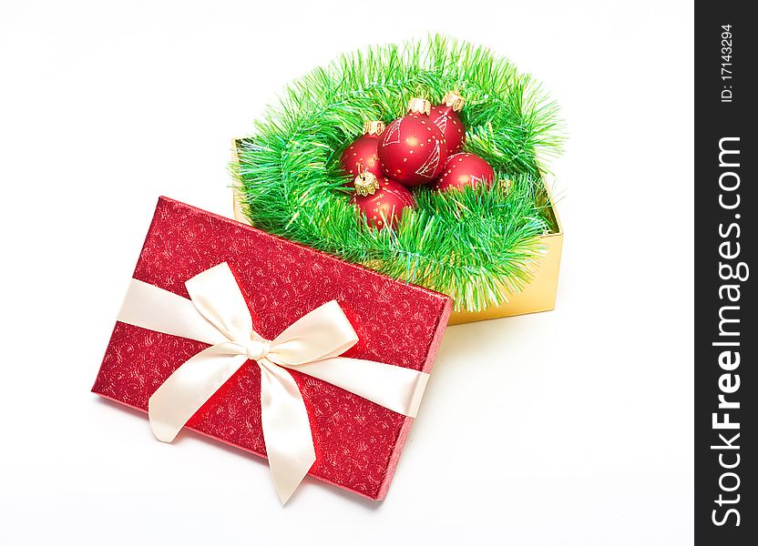 Red Gift box with baubles and tinsel