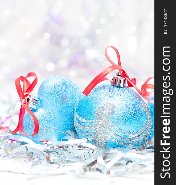 Blue Christmas balls on bright background