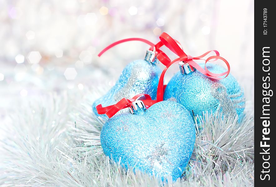 Blue Christmas balls on bright background