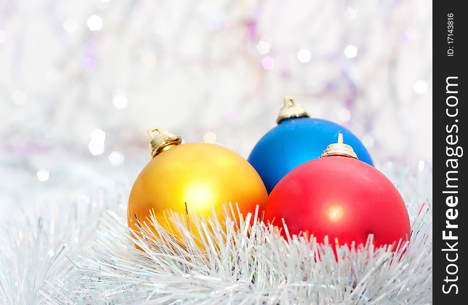 Color Christmas balls on bright background