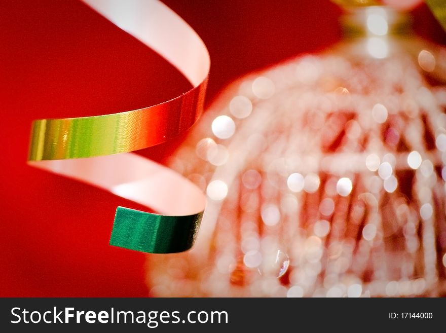 Golden christmas-tree tinsel over red. Abstract, bokeh. Golden christmas-tree tinsel over red. Abstract, bokeh