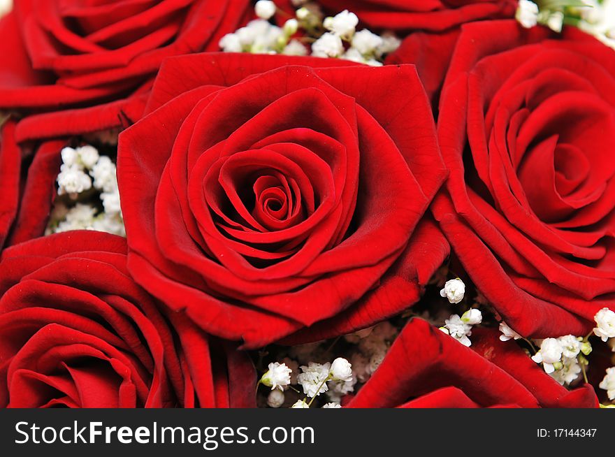 Detail of red roses on a wedding bouquet