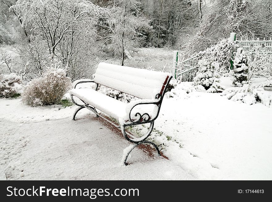 Snow-covered Bench