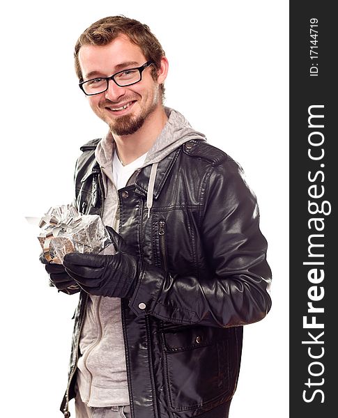 Warmly Dressed Handsome Young Man Holding Wrapped Gift Isolated on a White Background. Warmly Dressed Handsome Young Man Holding Wrapped Gift Isolated on a White Background.