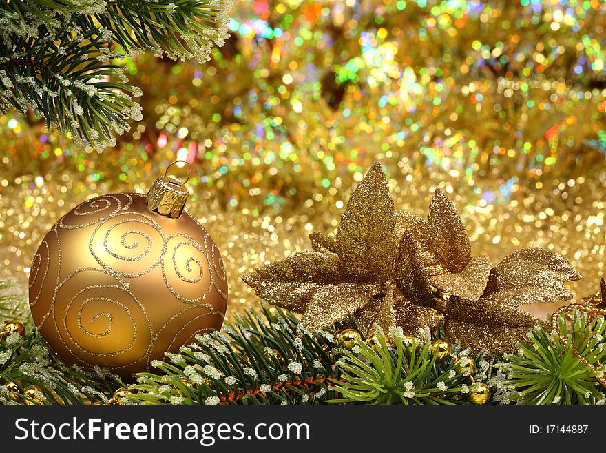 Christmas glitter ball and fir branch as christmas decoration.