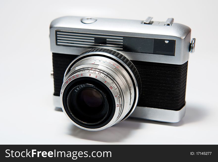 Picture of an old camera on a white background.