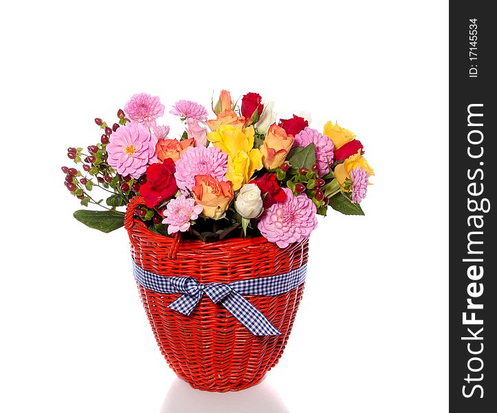 Varied colorful bouquet in an orange wicker basket isolated over white. Varied colorful bouquet in an orange wicker basket isolated over white