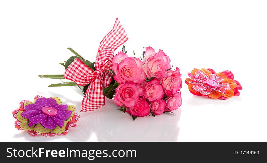 White roses with pink edges with a checkered ribbon isolated over white
