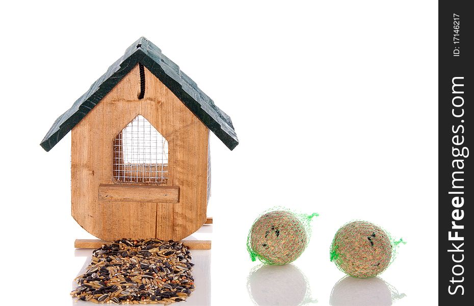 Wooden birdhouse with seeds