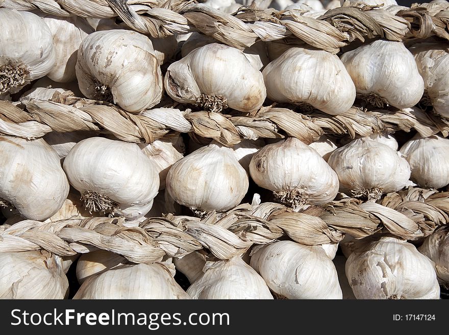 Garlic braid on the counter of the vegetable market