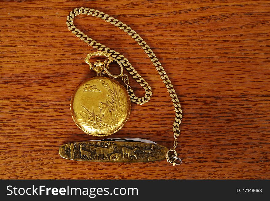 Gold Pocket watch on a table