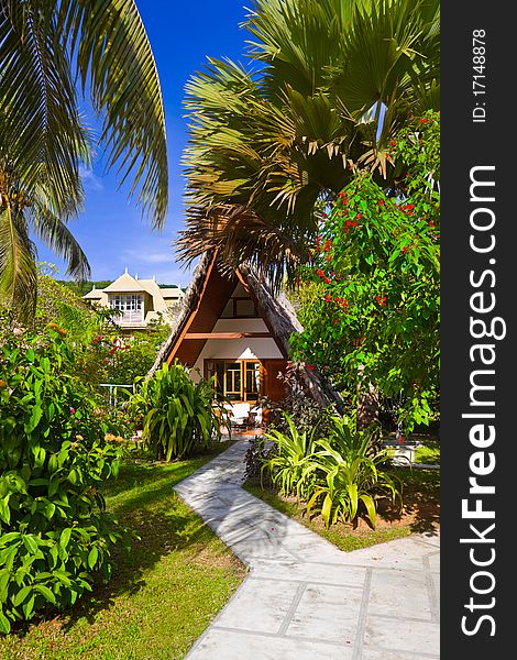 Bungalow in hotel at tropical beach - vacation background