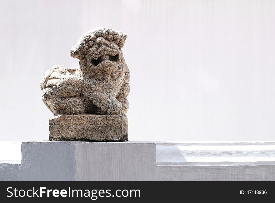 Sculpture of a lion and white wall. Sculpture of a lion and white wall.