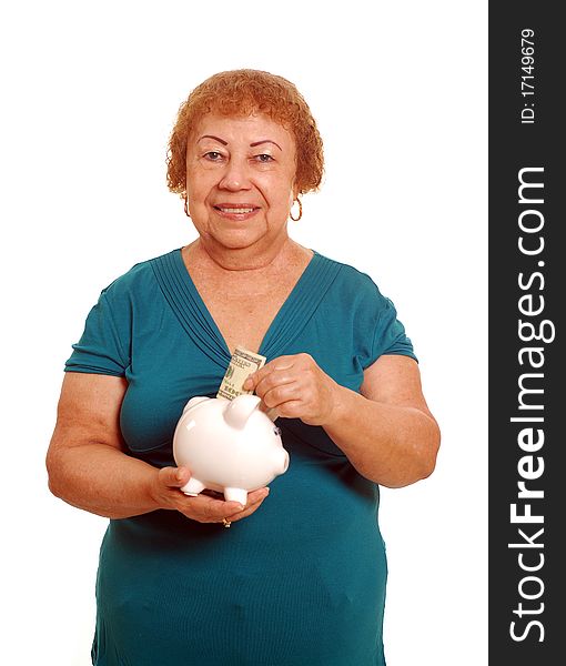 Hispanic female senior with piggy bank. Hispanic female senior with piggy bank