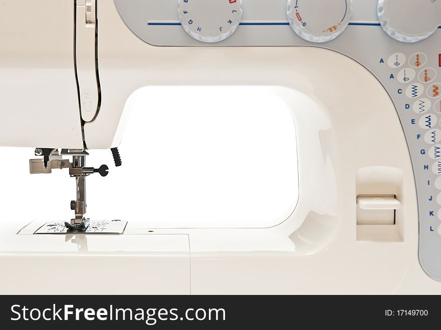 Sewing machine on white background. Studio shot