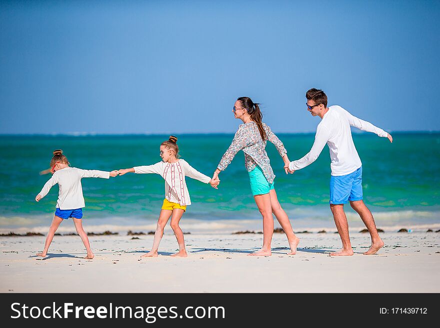 Family fun. Parents with kids on the beach. Family fun. Parents with kids on the beach