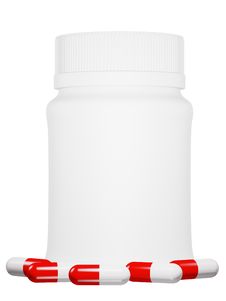 Capsule Pills And White Plastic Bottle. Royalty Free Stock Photography