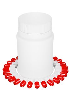 Capsule Pills And White Plastic Bottle. Royalty Free Stock Image
