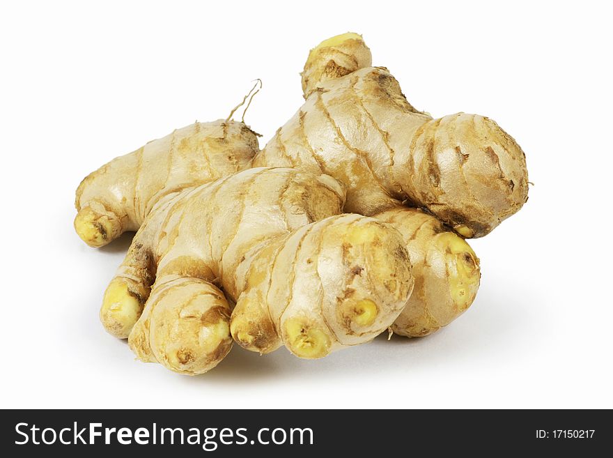 Whole and sliced ginger root in isolated white background