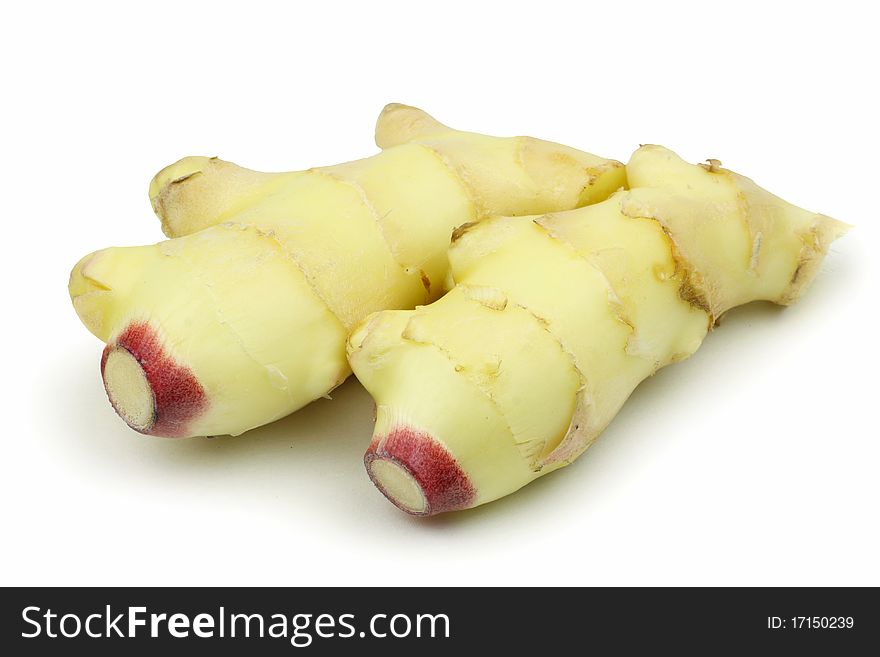Whole and sliced ginger root in isolated white background