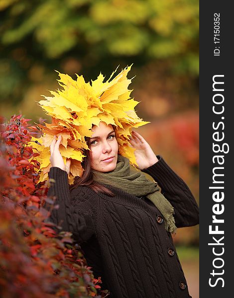 Woman in autumn wreath on a head. Woman in autumn wreath on a head