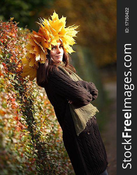 Woman in autumn wreath on a head. Woman in autumn wreath on a head