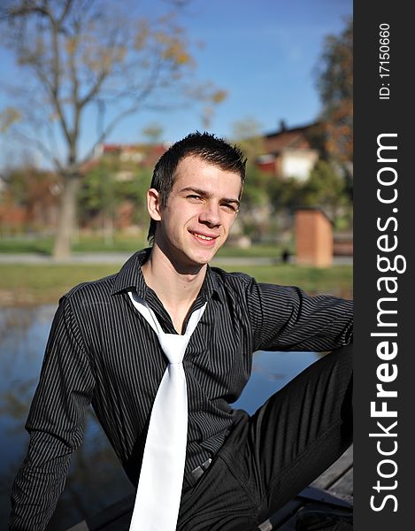 Portrait with attractive young man on a pontoon. Portrait with attractive young man on a pontoon