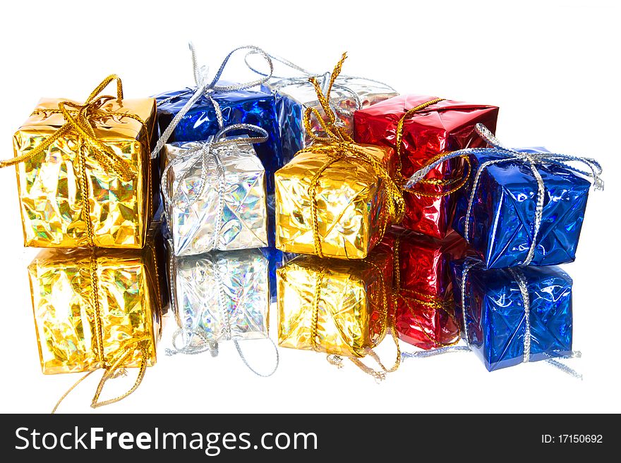 Set of colorful gift boxes isolated on white with reflection