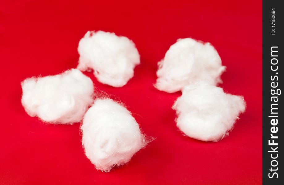 Medical cotton on a red background