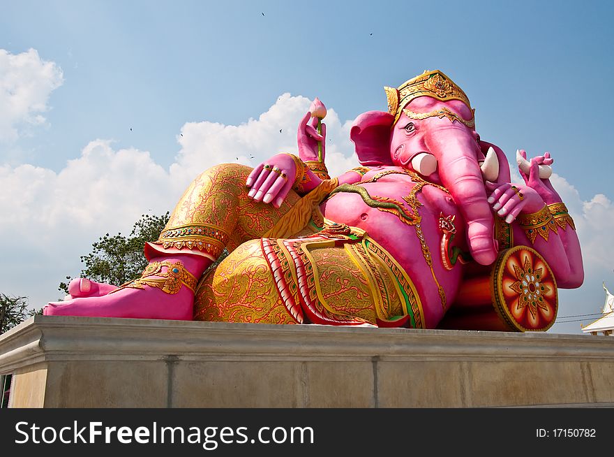 Pink ganesha statue in relaxing action, Thailand.