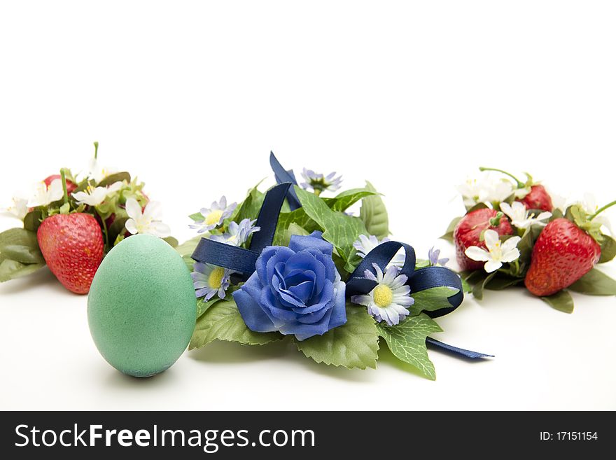 Easter-egg with strawberries and flower jewelry. Easter-egg with strawberries and flower jewelry
