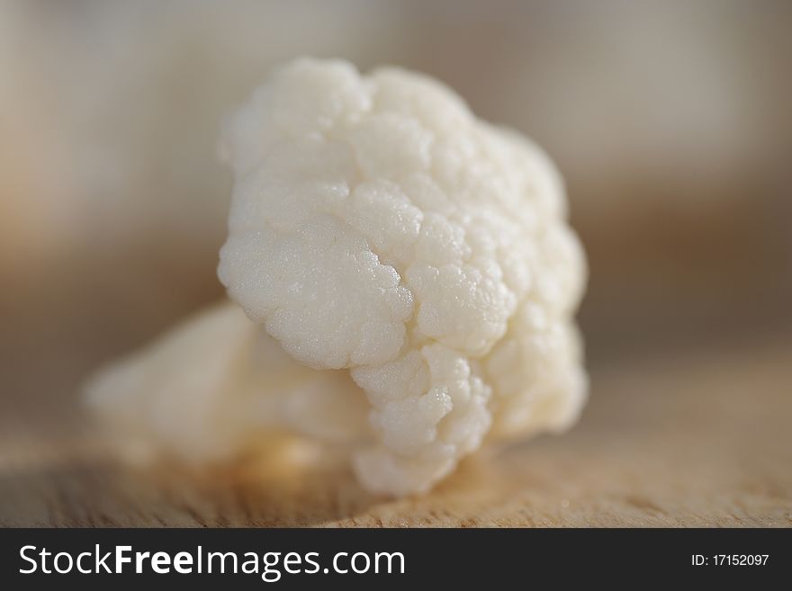 Fresh clean organic cauliflower on wooden table. Fresh clean organic cauliflower on wooden table