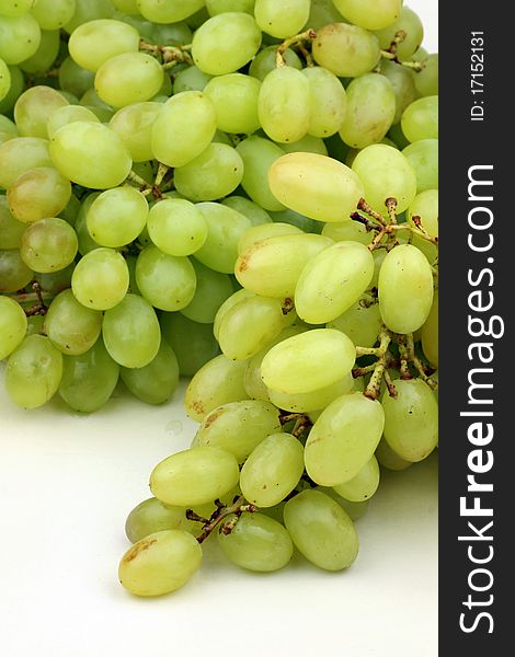 Green grapes on white background