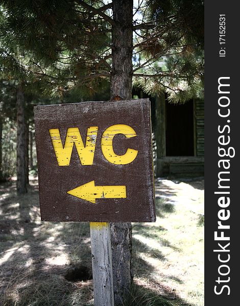 Trees in the forest region, wc sign