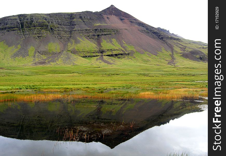 A Mountain Reflected In The Water