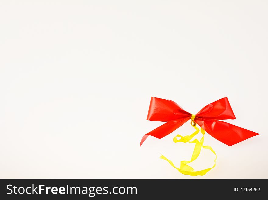 Christmas bow in right corner on white background