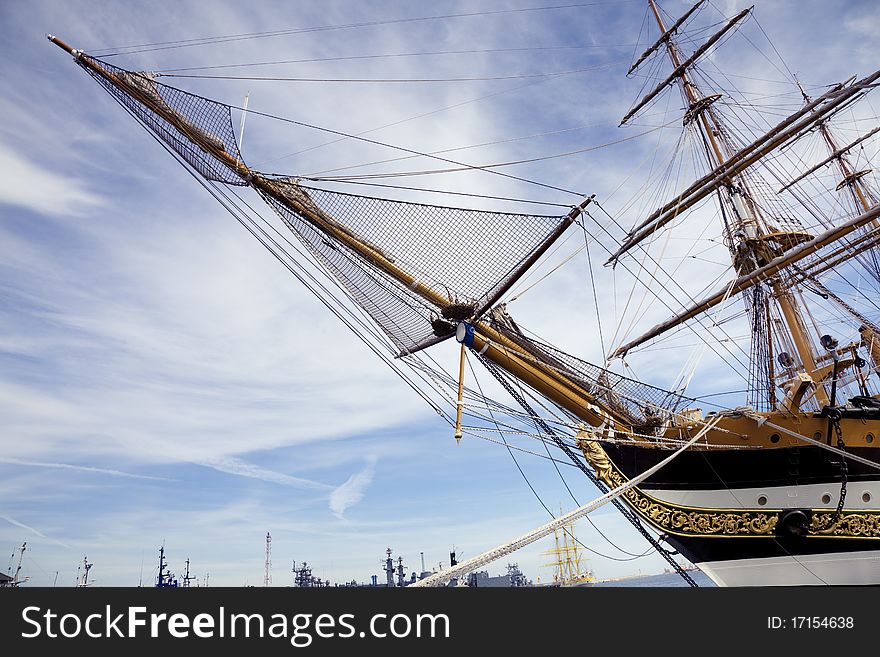 Front side of an old vessel with a blue sky in the background