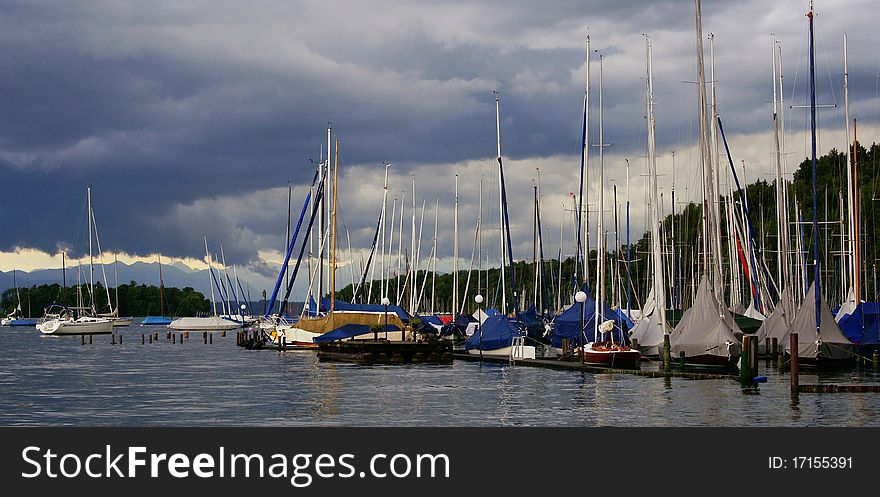 A storm is moving in over Lake Starnberg, Bavaria. The mountains in the distance are the Alps. A storm is moving in over Lake Starnberg, Bavaria. The mountains in the distance are the Alps.