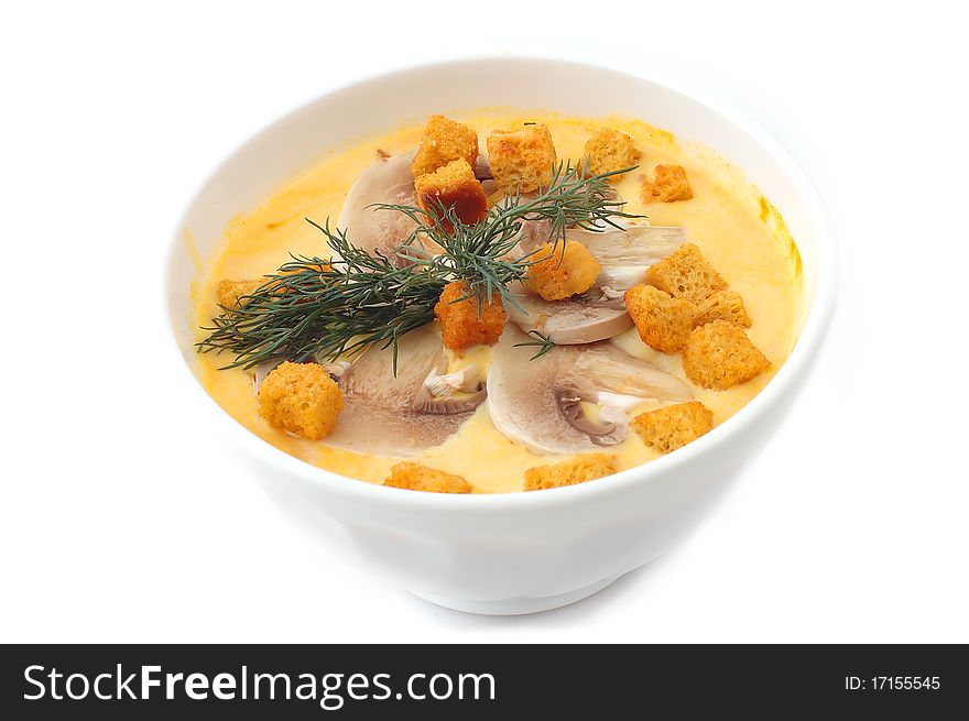 Soup with mushrooms and crackers on a white background. Soup with mushrooms and crackers on a white background
