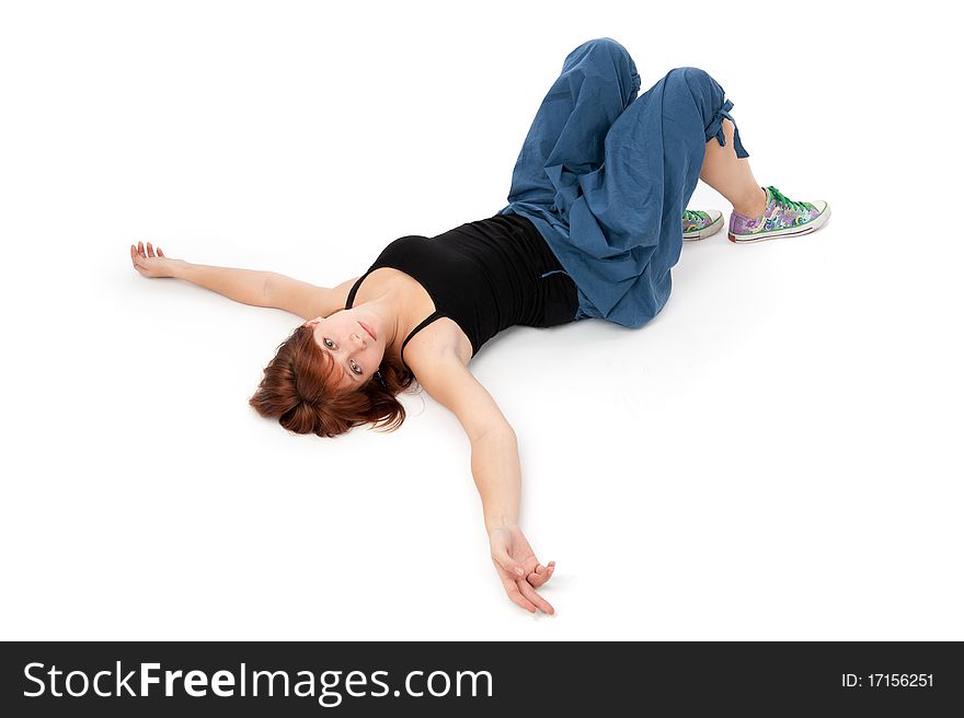 Young girl lying on a white floor