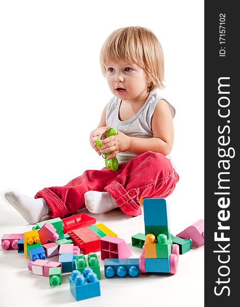 Cute Little Boy Playing With Colorful Blocks