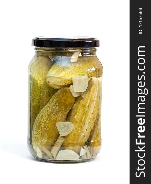 Glass jar with cucumbers on a white background. Glass jar with cucumbers on a white background.