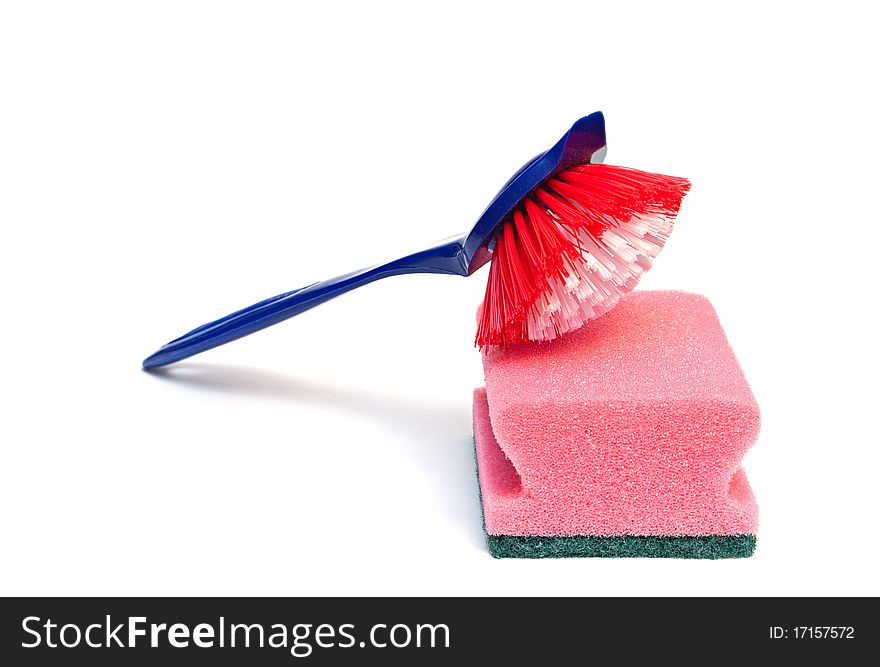 Cleaning brush and kitchen sponge isolated on a white background. Cleaning brush and kitchen sponge isolated on a white background.