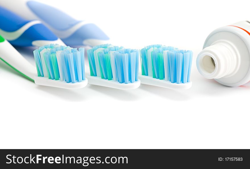 Three toothbrushes isolated on a white background. Three toothbrushes isolated on a white background.