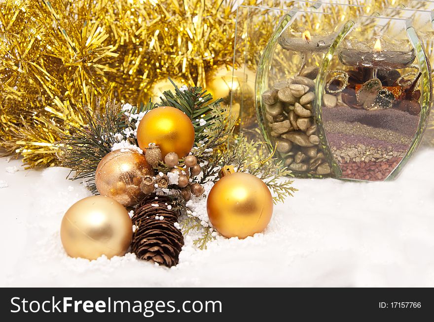 Christmas decoration of golden color in the snow