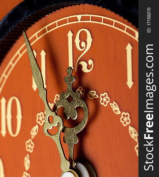 Closeup view of antique clock face. Last minutes before midnight.