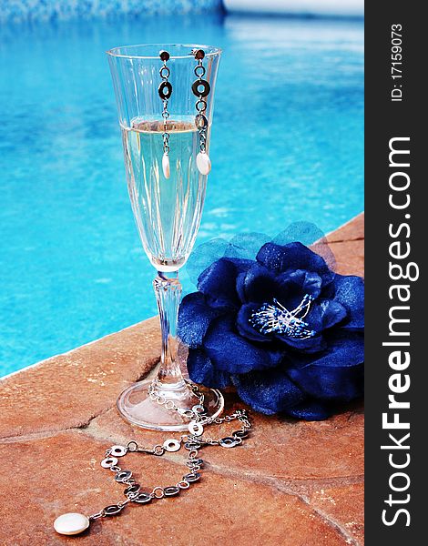 Pleasures of life: champagne, relaxing in the pool, jewelries